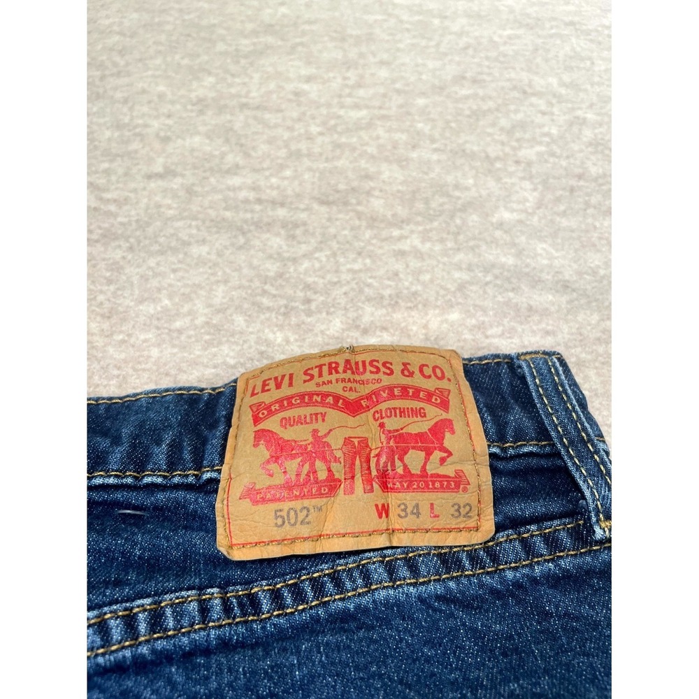 Levi's 502 Taper Fit Jeans Mens 34x32 Blue Whiskering Denim Medium Wash Mid Rise - Picture 9 of 16